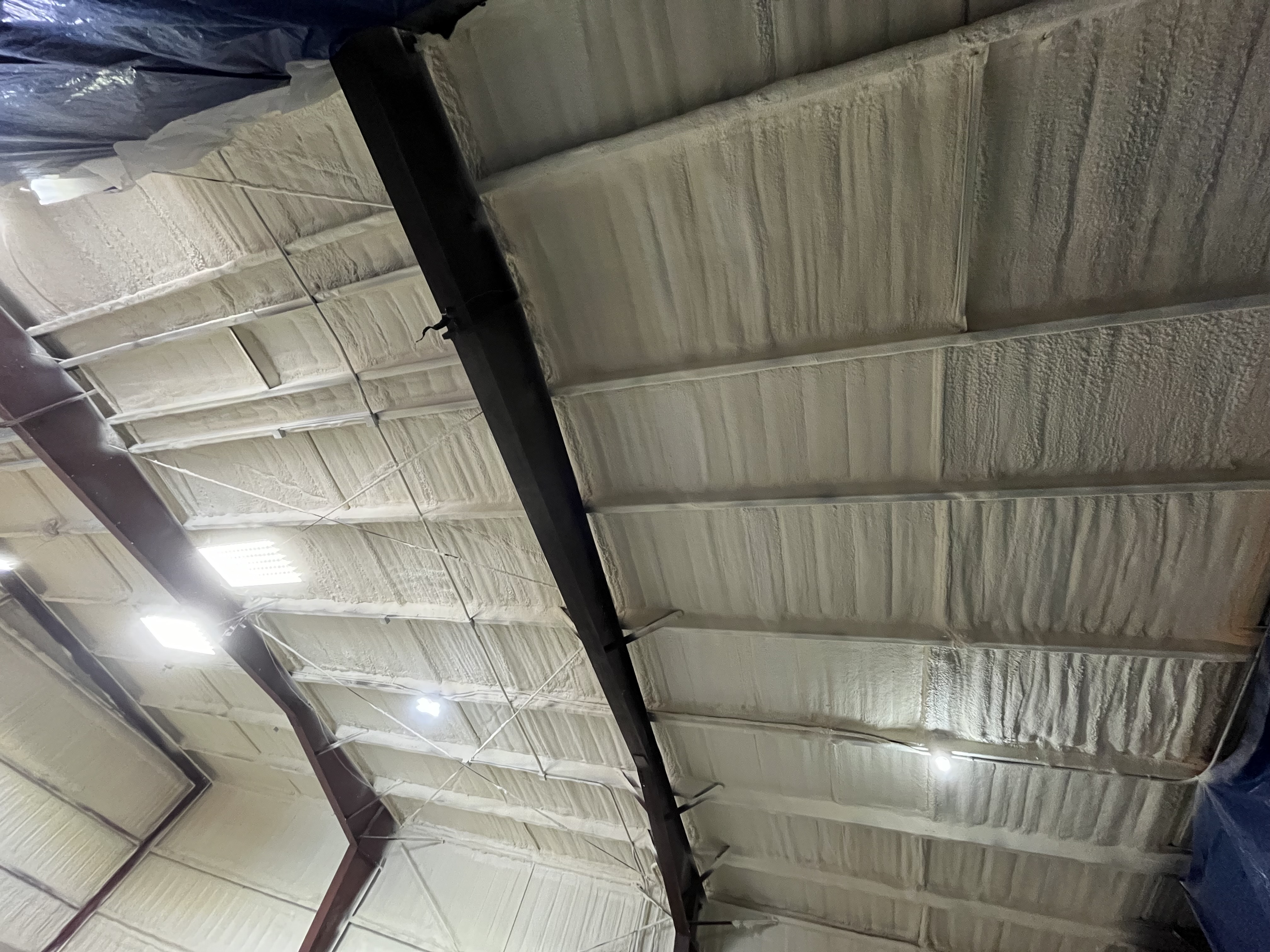 Commercial roof deck closed cell foam application